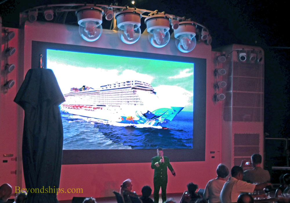 Captain addressing reception on Norwegian Escape cruise ship
