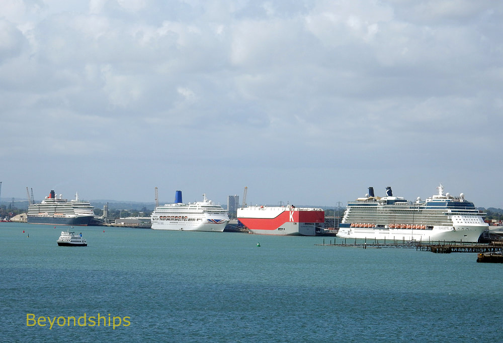 Cruise ships Queen Victoria, Oriana, and Celebrity Silhouette with a cargo ship.