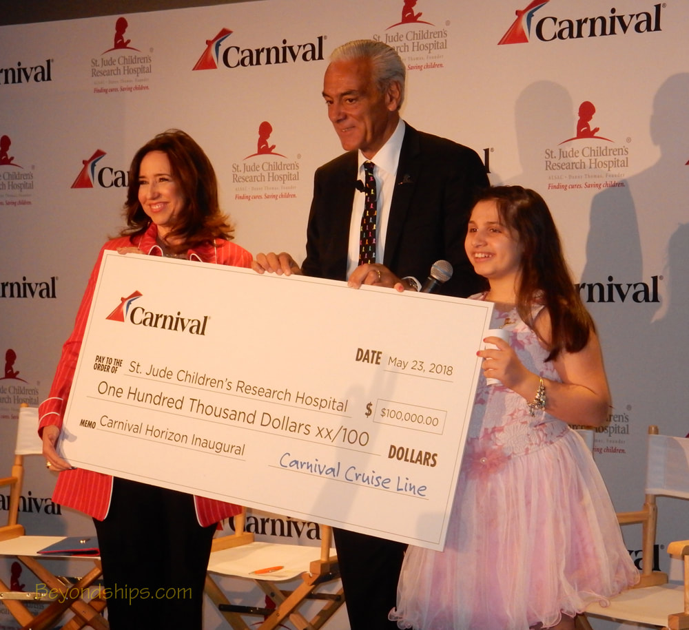 Christine Duffy of Carnival giving Richard Shadyac a donation for St. Jude's Children's Research Hospital