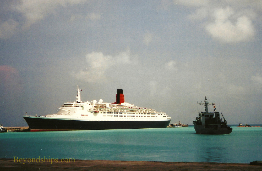 Warship and QE2, Queen Elizabeth 2, ocean liner, in Barbados