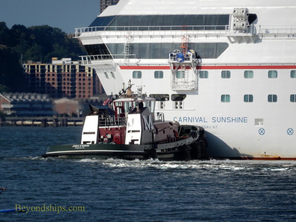 tug boat assisting cruise ship