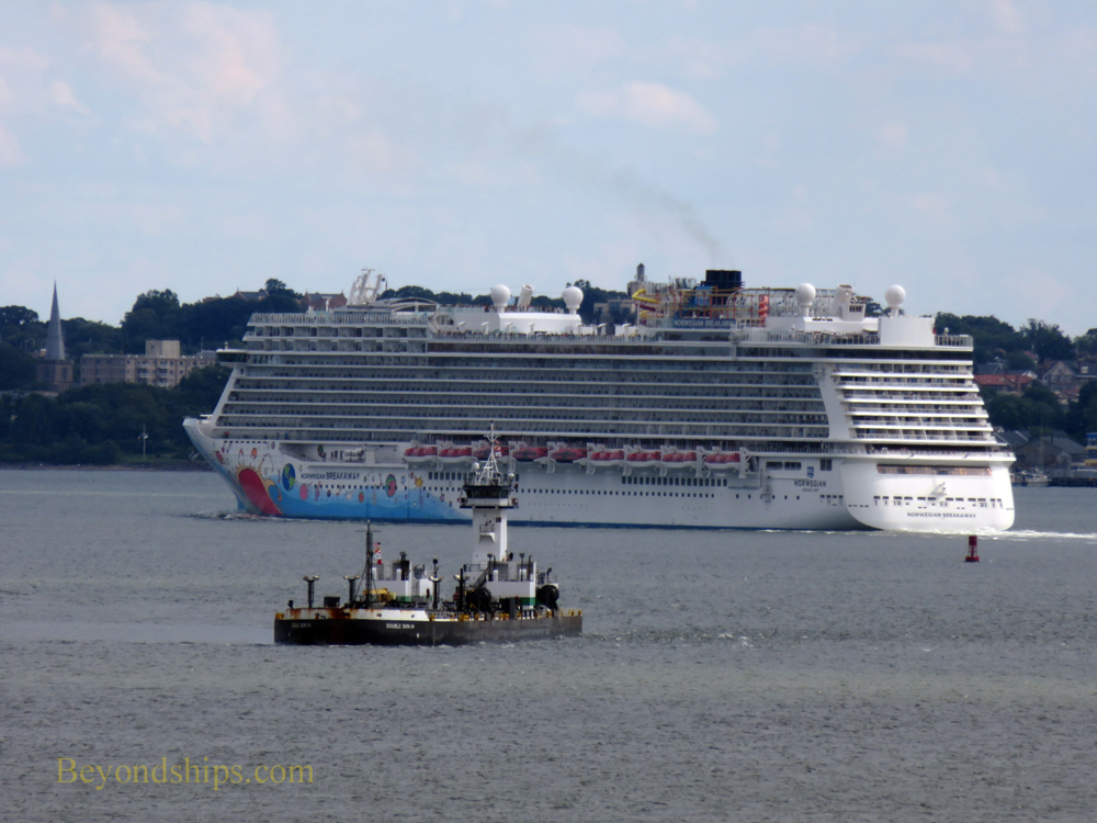 Norwegian Breakaway cruise ship with barge